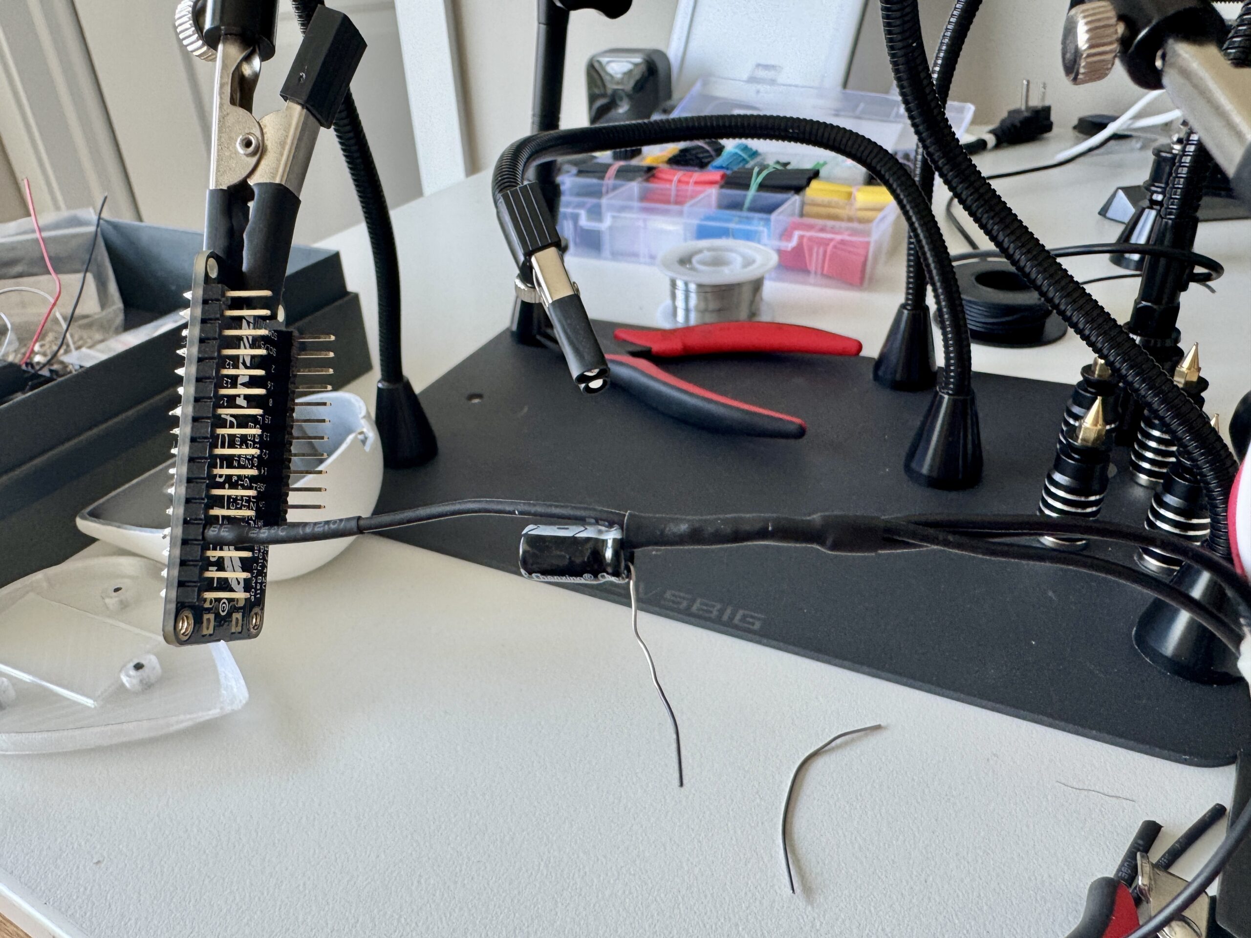 Soldering the LED ring and microcontroller at the bench