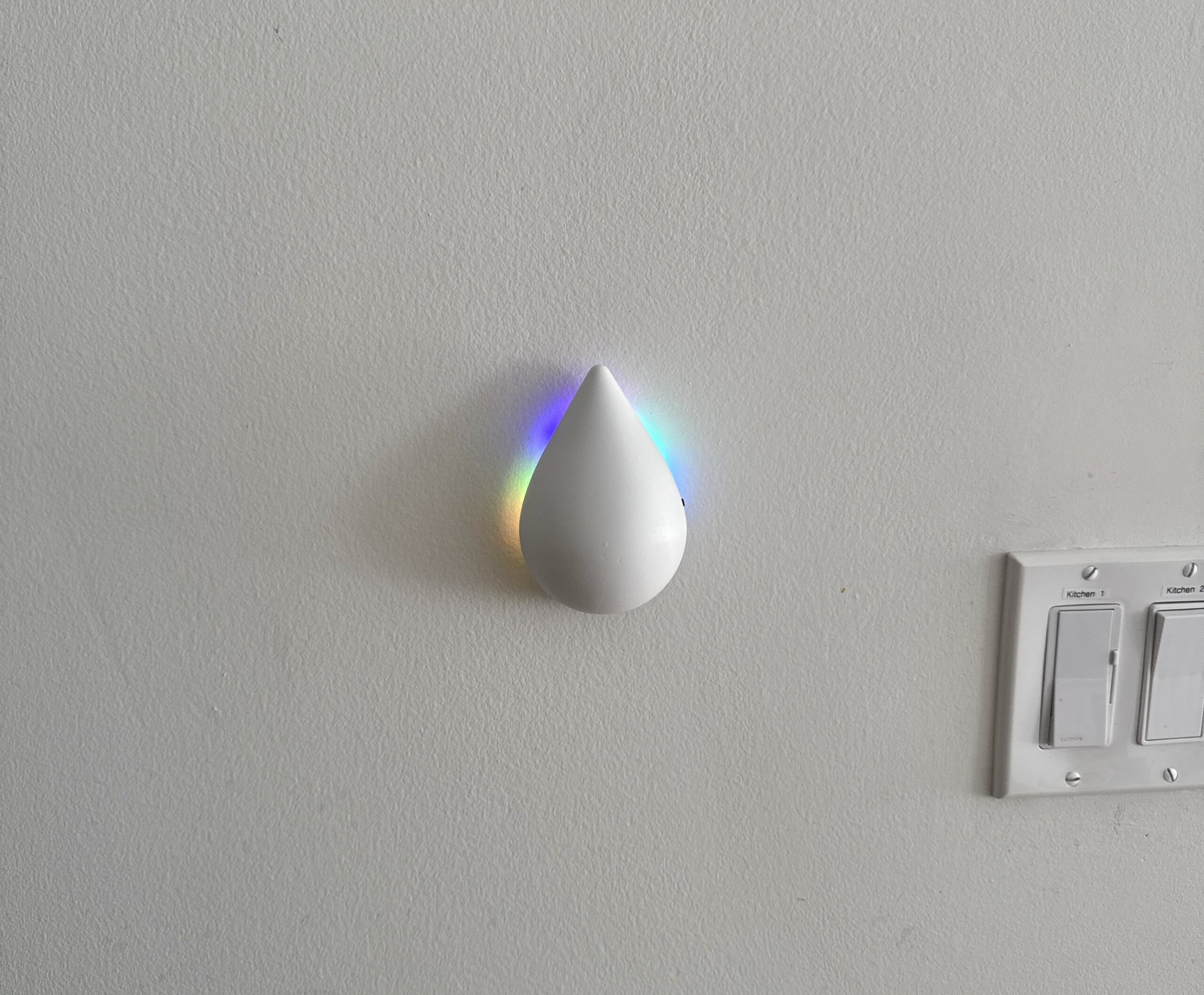 The finished light mounted on the wall by the front door
